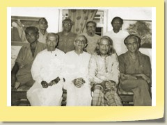(back, from left) Piraji Sagara, Nalin Rawal, Labhshankar Thakar, Hasmukh Pathak, Chandrakant Sheth. (front) 'Sundaram', Umashankar Joshi, -, Niranjan Bhagat (UJ-O39)